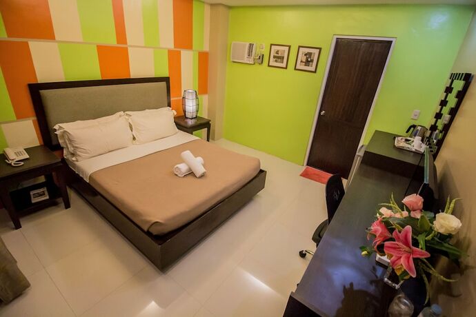 Imagen de la habitación del Hotel The Red Palm Suites And Restaurant. Foto 17