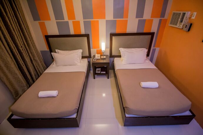 Imagen de la habitación del Hotel The Red Palm Suites And Restaurant. Foto 21