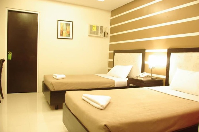 Imagen de la habitación del Hotel The Red Palm Suites And Restaurant. Foto 24
