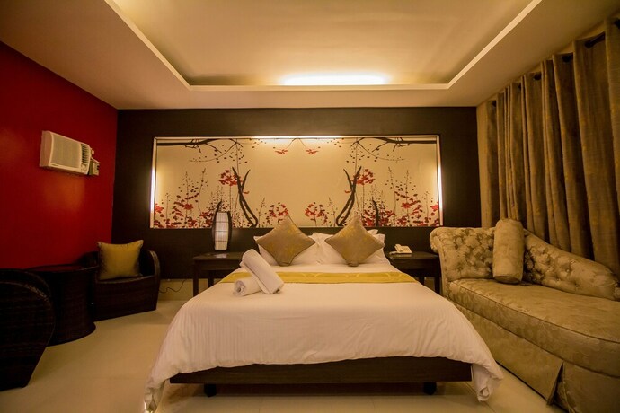 Imagen de la habitación del Hotel The Red Palm Suites And Restaurant. Foto 28
