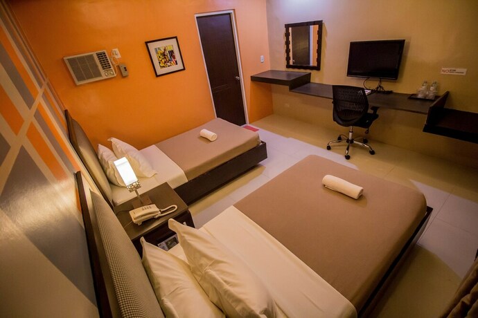 Imagen de la habitación del Hotel The Red Palm Suites And Restaurant. Foto 30