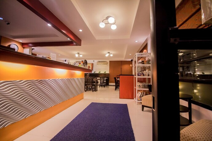 Imagen de los interiores del Hotel The Red Palm Suites And Restaurant. Foto 32