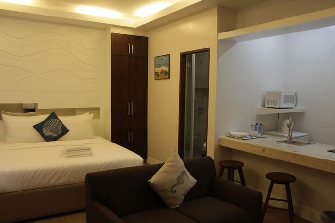 Imagen de la habitación del Hotel The Reef and Residences. Foto 19