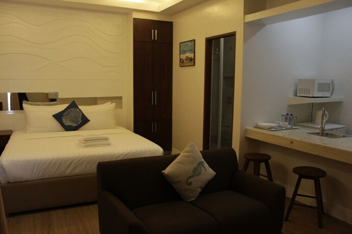 Imagen de la habitación del Hotel The Reef and Residences. Foto 24