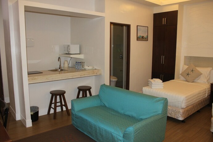 Imagen de la habitación del Hotel The Reef and Residences. Foto 25