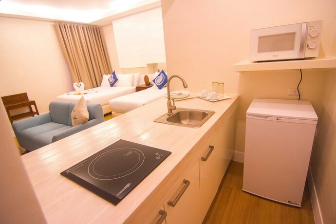 Imagen de la habitación del Hotel The Reef and Residences. Foto 28