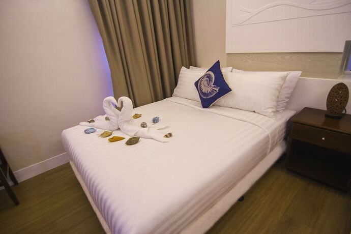 Imagen de la habitación del Hotel The Reef and Residences. Foto 29