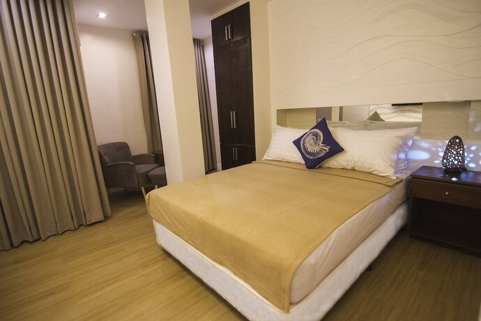 Imagen de la habitación del Hotel The Reef and Residences. Foto 32