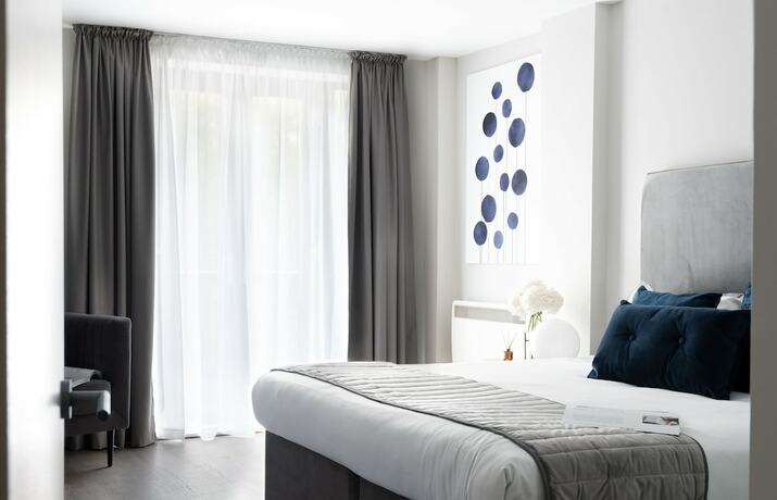 Imagen de la habitación del Hotel The Residen. Foto 18