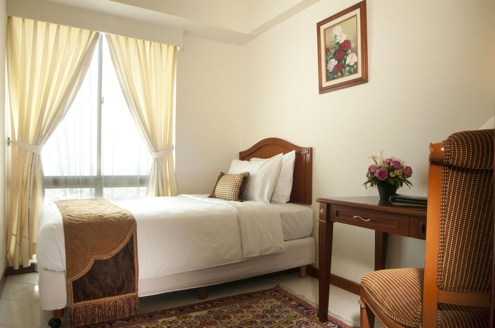 Imagen de la habitación del Hotel The Residences At Puri Casablanca. Foto 4