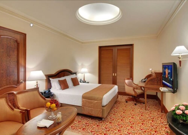 Imagen de la habitación del Hotel The Residency Towers. Foto 11