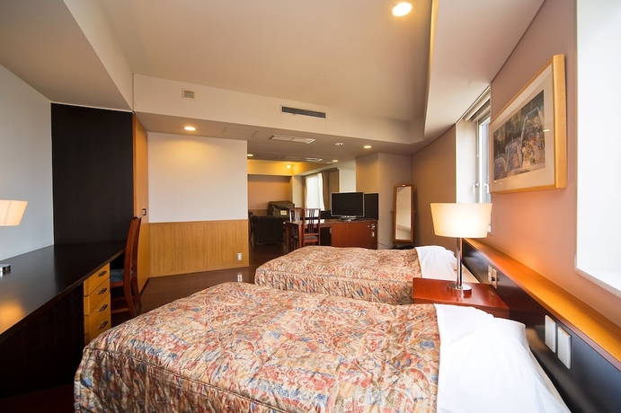 Imagen de la habitación del Hotel The Residential Suites Fukuoka. Foto 12