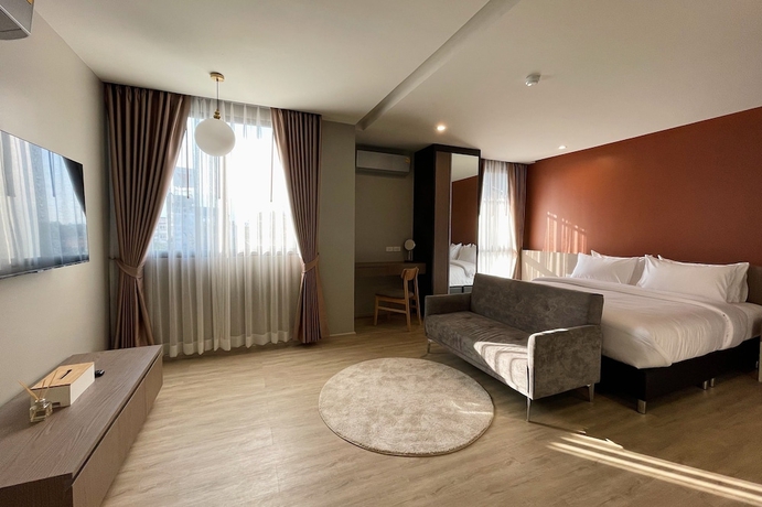 Imagen de la habitación del Hotel The Rise Suites Chiang Mai. Foto 1