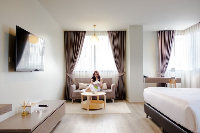 Imagen de la habitación del Hotel The Rise Suites Chiang Mai. Foto 7