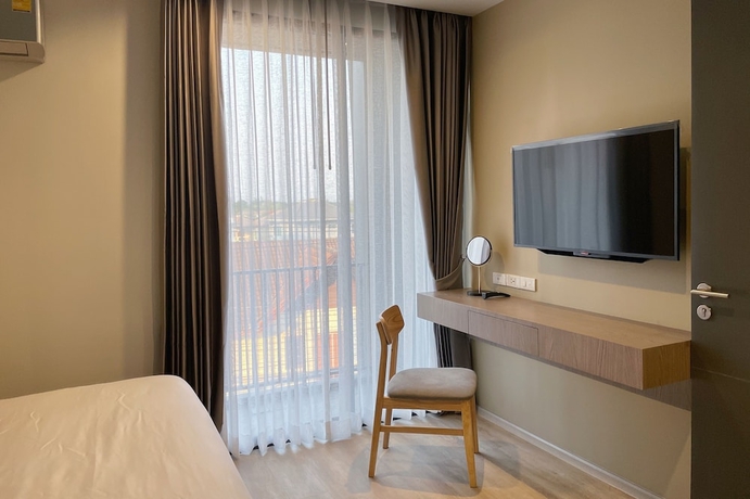 Imagen de la habitación del Hotel The Rise Suites Chiang Mai. Foto 10