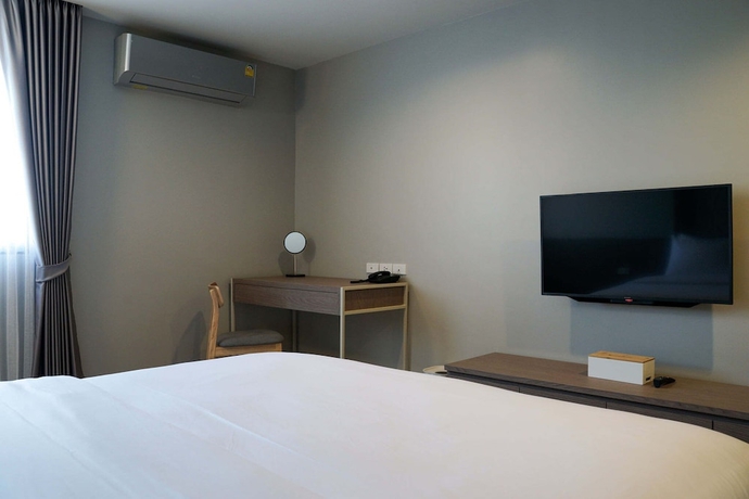 Imagen de la habitación del Hotel The Rise Suites Chiang Mai. Foto 13