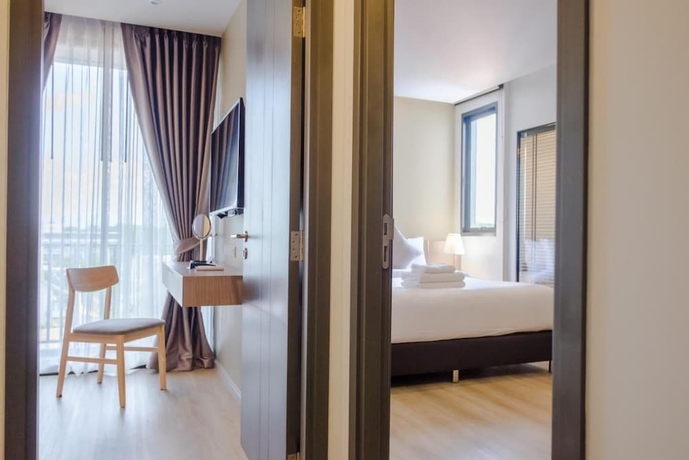 Imagen de la habitación del Hotel The Rise Suites Chiang Mai. Foto 14