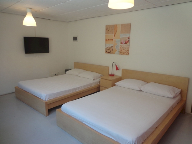 Imagen de la habitación del Hotel The Ritz Village. Foto 2