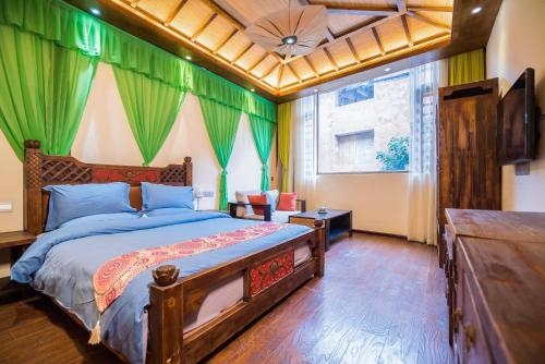 Imagen de la habitación del Hotel The Ritz-man Boutique Inn Lijiang. Foto 6