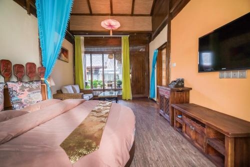 Imagen de la habitación del Hotel The Ritz-man Boutique Inn Lijiang. Foto 7