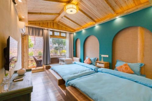 Imagen de la habitación del Hotel The Ritz-man Boutique Inn Lijiang. Foto 8