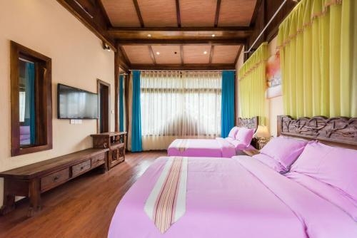Imagen de la habitación del Hotel The Ritz-man Boutique Inn Lijiang. Foto 9