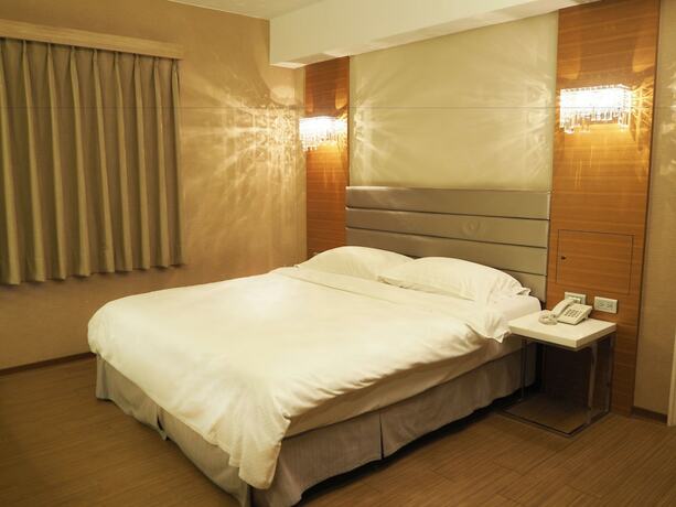 Imagen de la habitación del Hotel The Riverside Esthetics. Foto 15