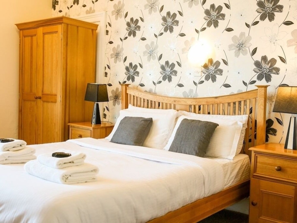 Imagen de la habitación del Hotel The Riviera Guest House. Foto 10