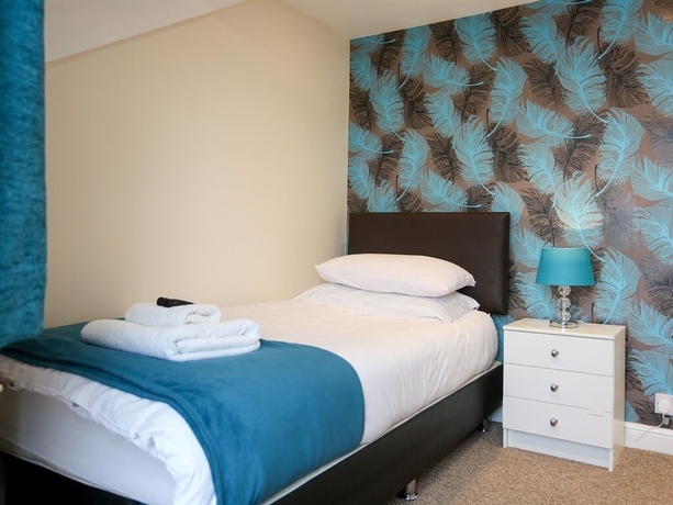 Imagen de la habitación del Hotel The Riviera Guest House. Foto 13
