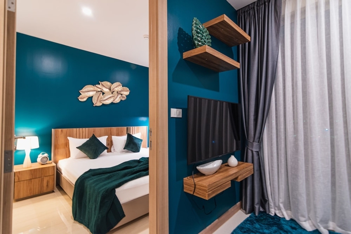 Imagen de la habitación del Hotel The Riviera Jomtien By Pattaya Holiday. Foto 16