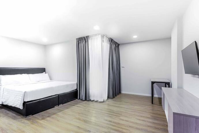 Imagen de la habitación del Hotel The Rizin Phratumnak. Foto 7