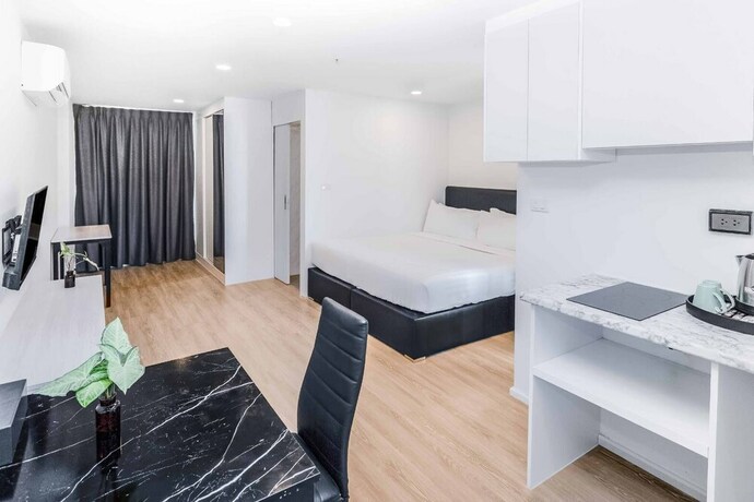 Imagen de la habitación del Hotel The Rizin Phratumnak. Foto 11