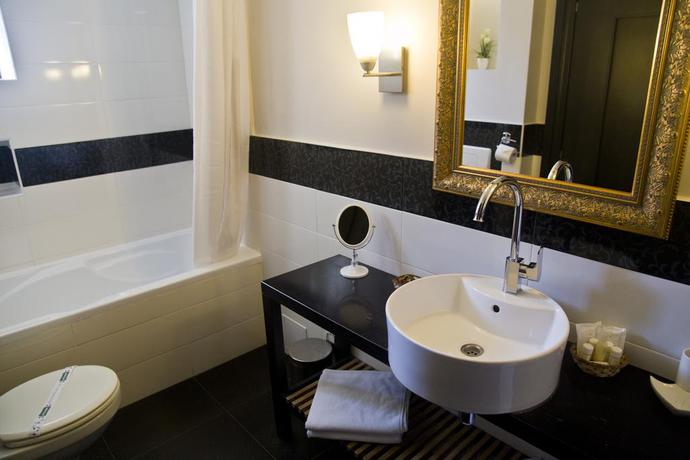 Imagen de la habitación del Hotel The Rizzo Boutique. Foto 2