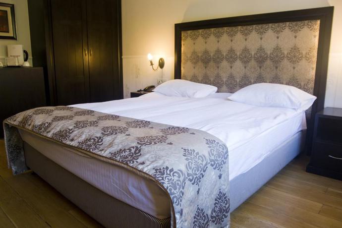 Imagen de la habitación del Hotel The Rizzo Boutique. Foto 3