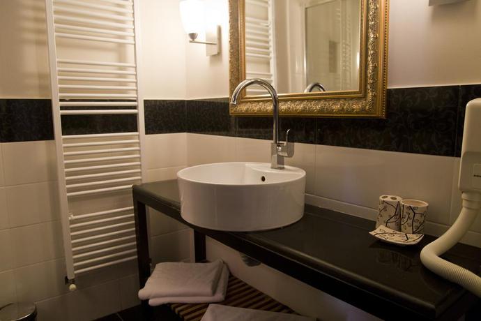 Imagen de la habitación del Hotel The Rizzo Boutique. Foto 4