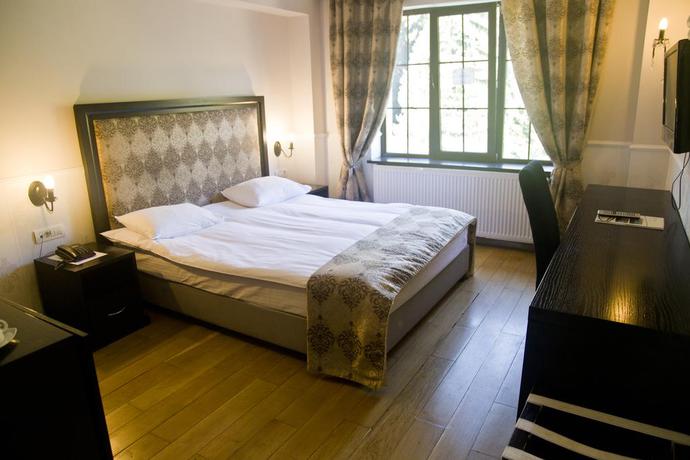 Imagen de la habitación del Hotel The Rizzo Boutique. Foto 6