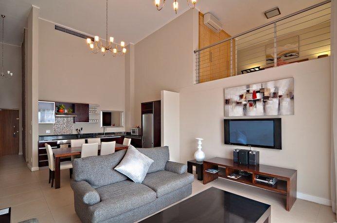 Imagen de la habitación del Hotel The Rockwell Luxury Suites. Foto 9