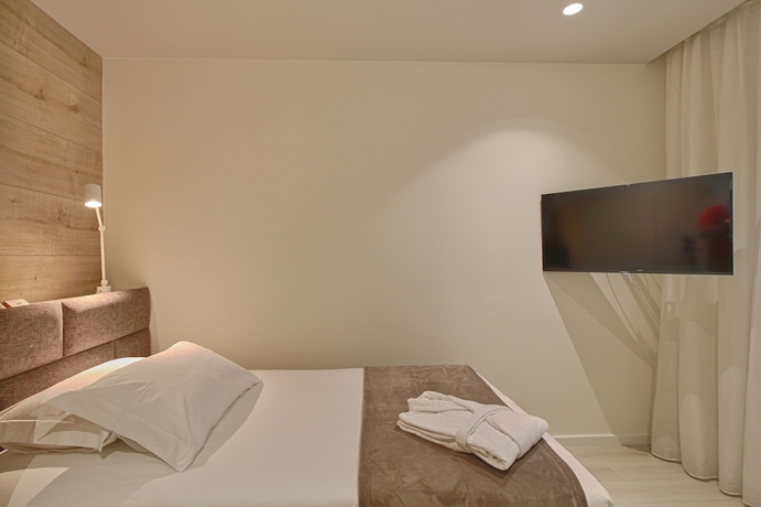 Imagen de la habitación del Hotel The Rooms Apartments Tirana. Foto 19