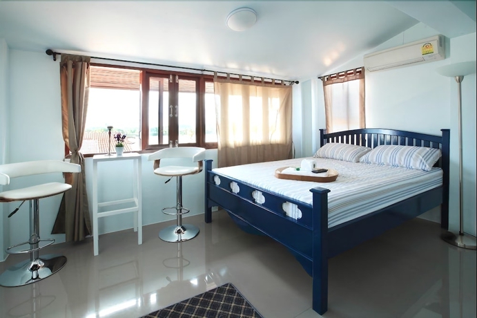 Imagen de la habitación del Hotel The Royal Chiangkhan Boutique. Foto 4