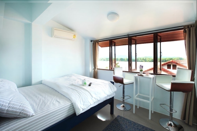 Imagen de la habitación del Hotel The Royal Chiangkhan Boutique. Foto 5