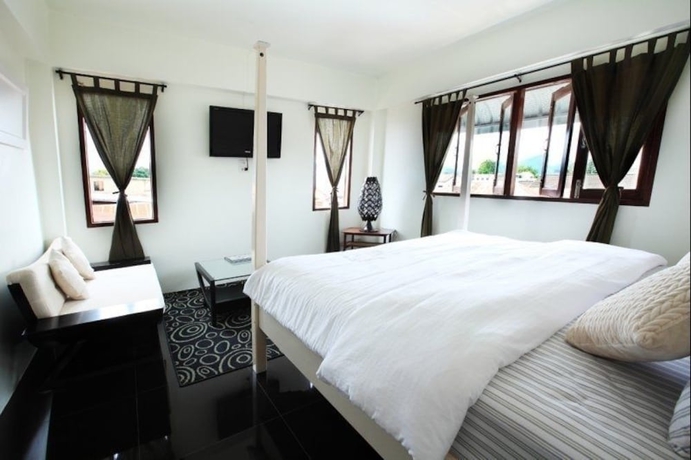 Imagen de la habitación del Hotel The Royal Chiangkhan Boutique. Foto 14