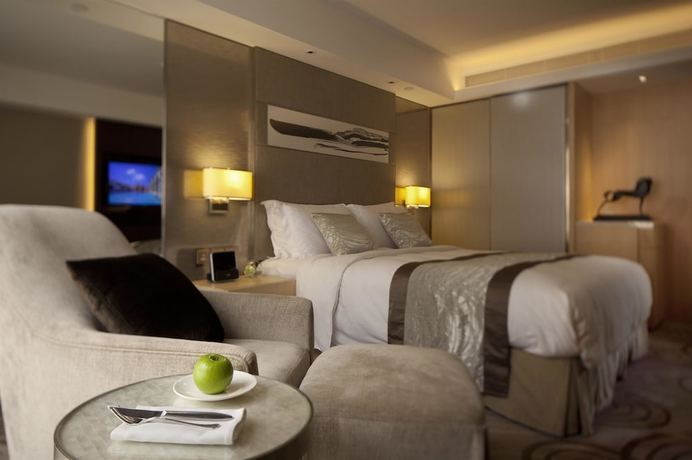 Imagen de la habitación del Hotel The Royal Garden. Foto 4