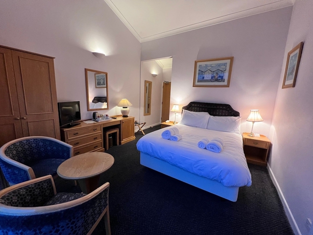 Imagen de la habitación del Hotel The Royal Lion. Foto 12