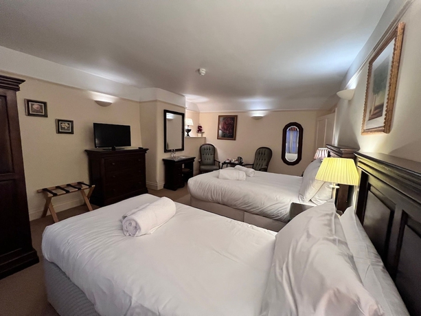Imagen de la habitación del Hotel The Royal Lion. Foto 13