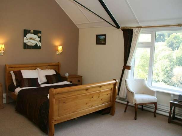 Imagen de la habitación del Hotel The Royal Lodge. Foto 15