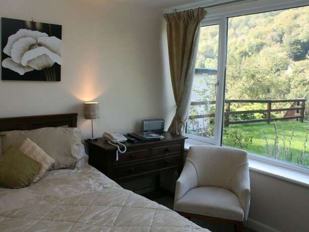 Imagen de la habitación del Hotel The Royal Lodge. Foto 17