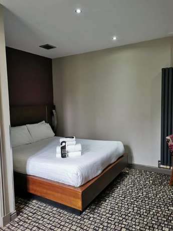 Imagen de la habitación del Hotel The Rutland. Foto 13