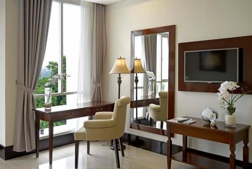 Imagen de la habitación del Hotel The Sahira. Foto 8