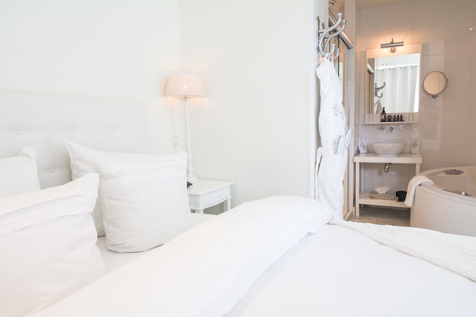 Imagen de la habitación del Hotel The Saints Bliss. Foto 7