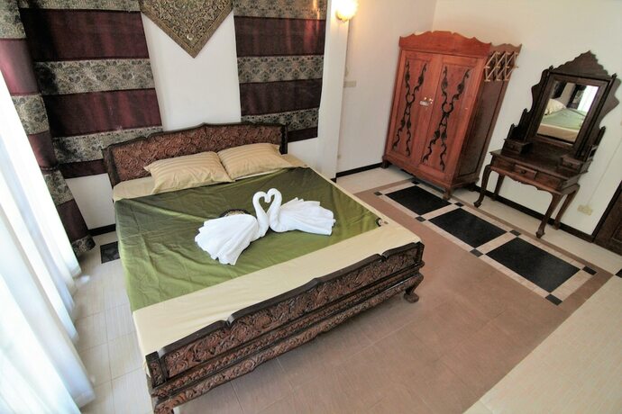 Imagen de la habitación del Hotel The Sali-Kham Traditional Lanna Home. Foto 6